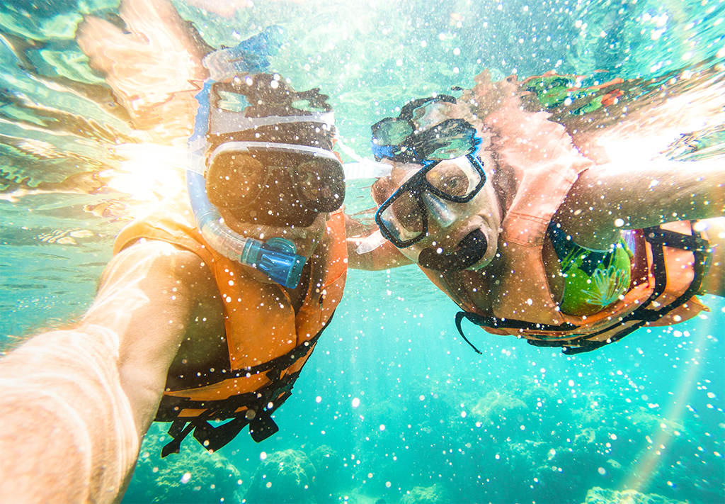 Couple Snorkeling in The Ocean