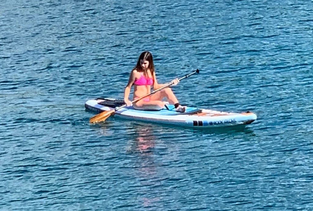 Woman Paddle Boarding in the Ocean
